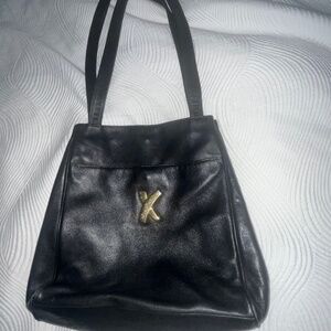 Paloma Picasso black leather vintage handbag w/gold accents, Near new condition